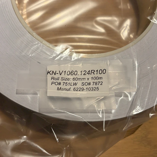KN v1060 wrapped roll with label