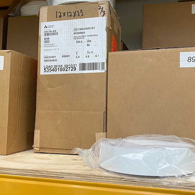Labelled cartons and bagged roll on rack