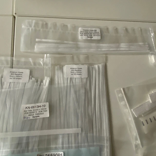 Labelled sample bags of strips on table