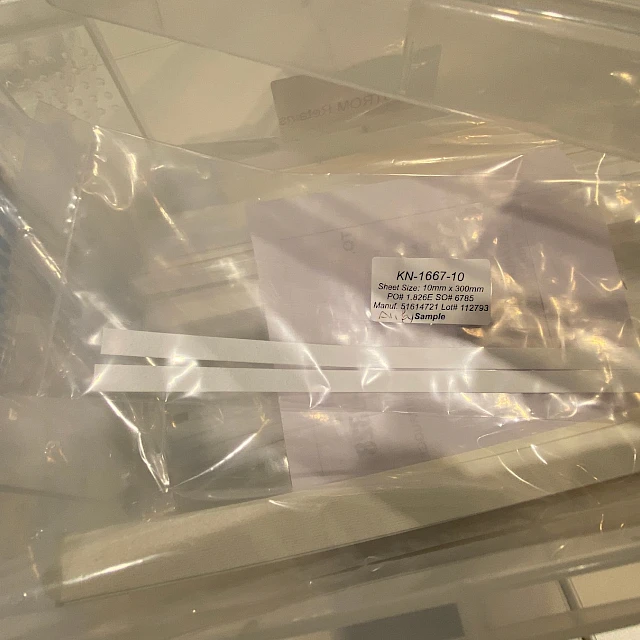 Labelled sample strips in plastic bags in tray