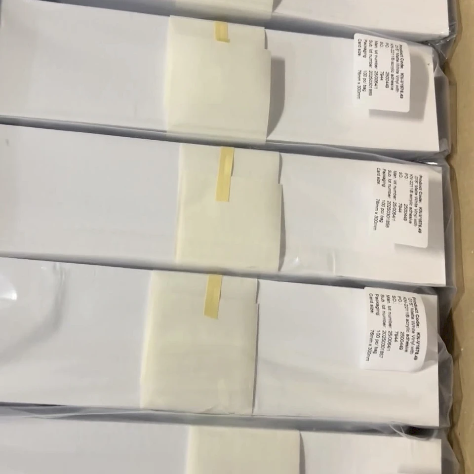 Labelled white card bundles in carton