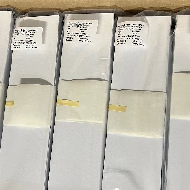Labelled white card bundles in carton