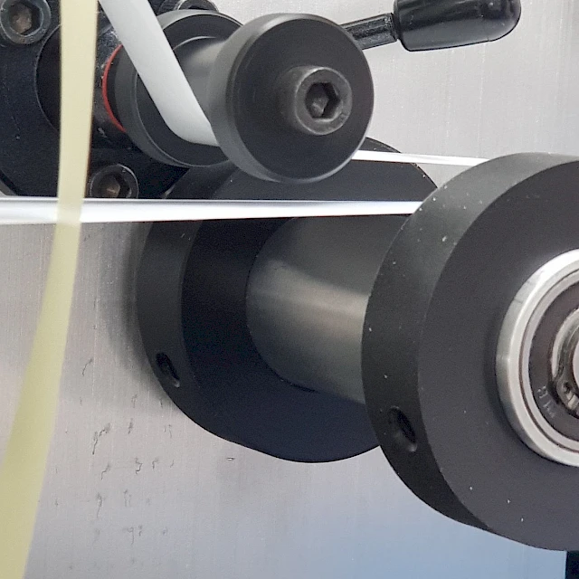 Liner strip guide roller close up