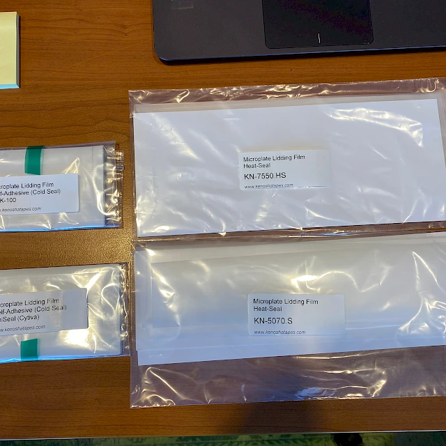 Microplate lidding film sample bags on desk