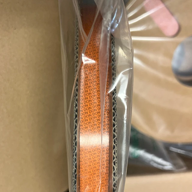 Orange tape roll edge in bag