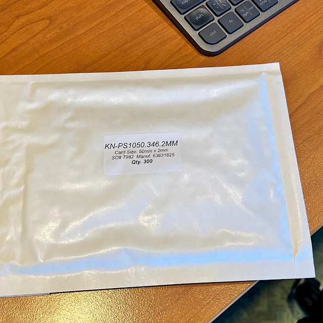 Padded envelope with product label on desk