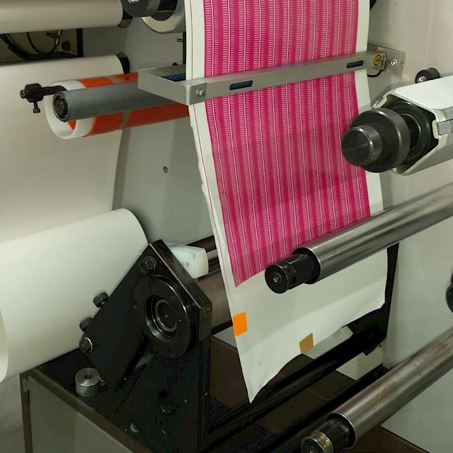 Pink printed web on label press