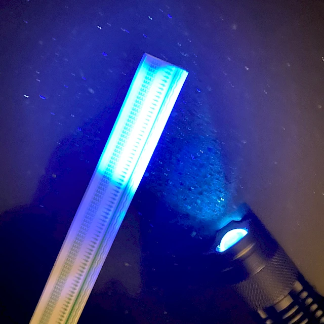 Printed tape strip under UV flashlight