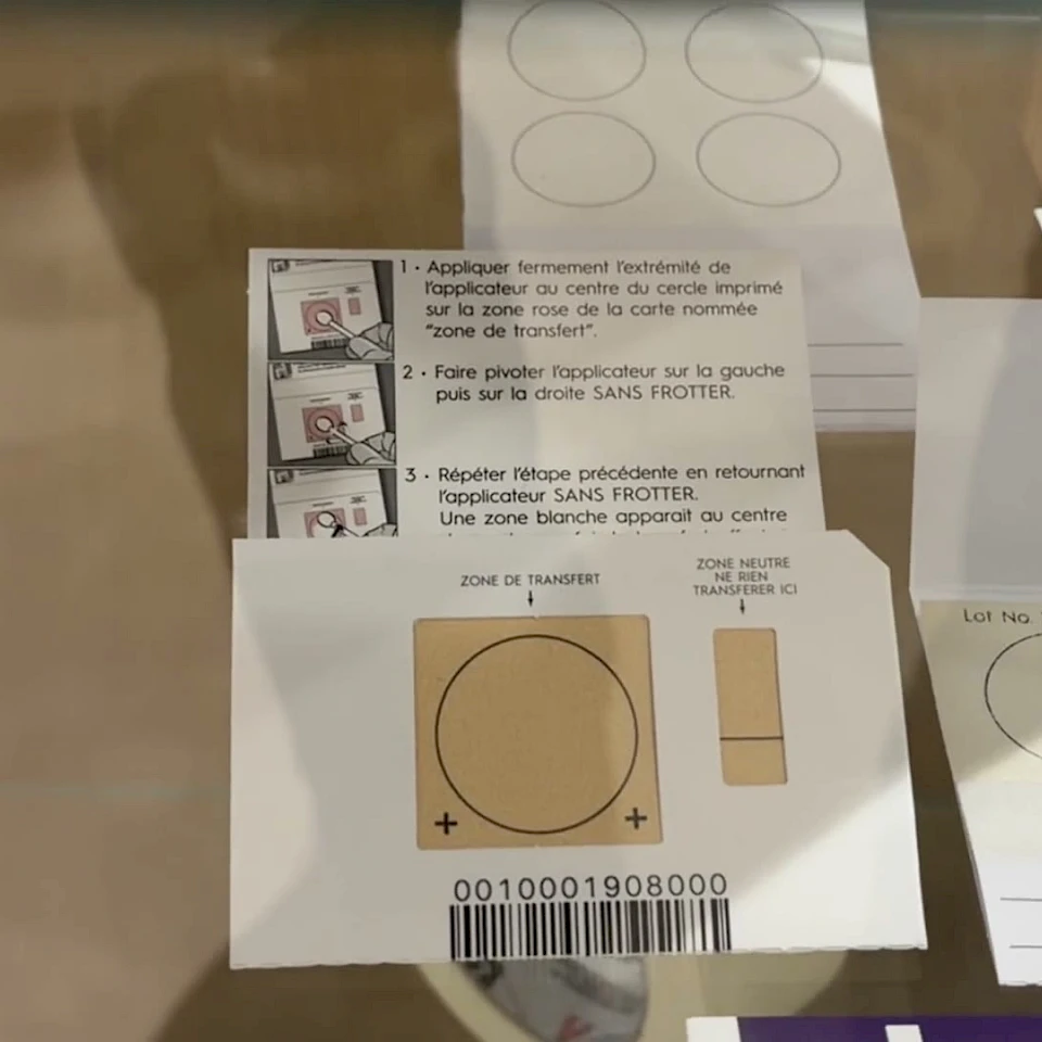 Printed transfer cards with instructions on glass