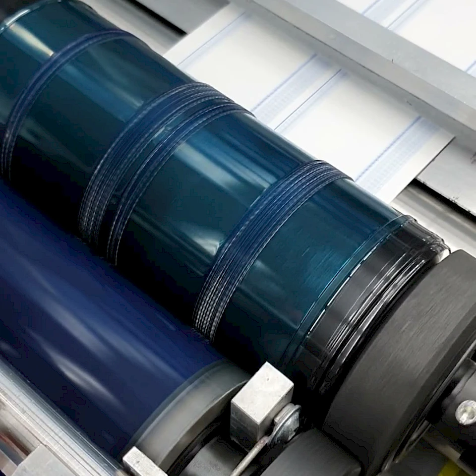 Printed web running through laminator