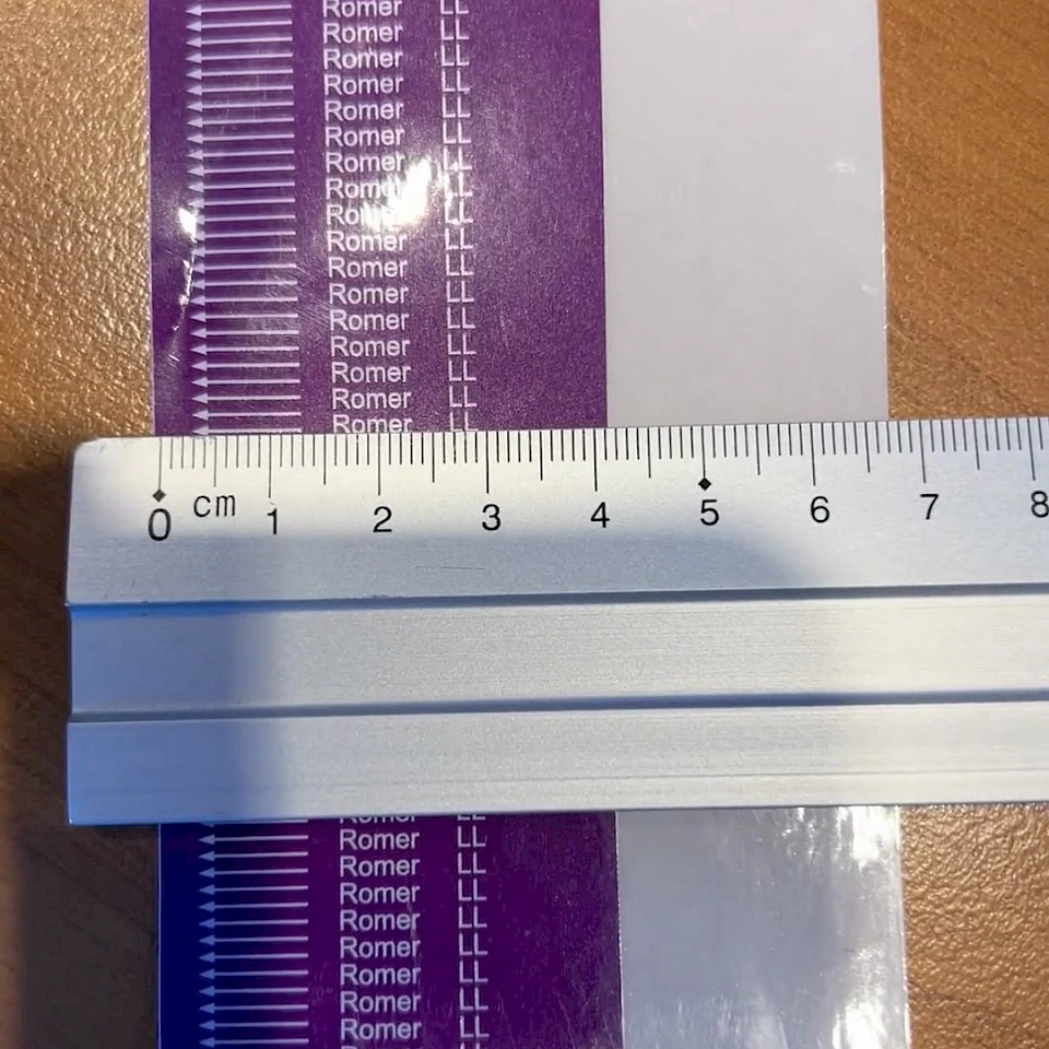 Purple romer printed tape measured with ruler