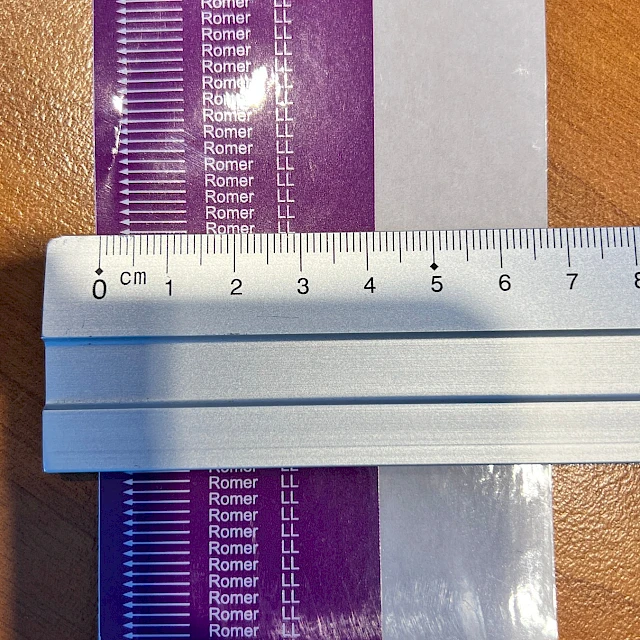 Purple romer printed tape measured with ruler