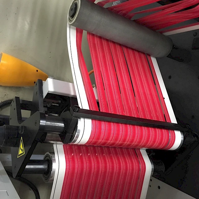Red printed strips on rotary die cutter