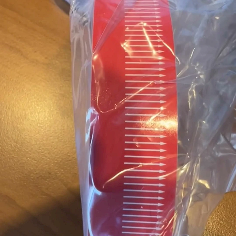 Red scale printed tape roll in bag