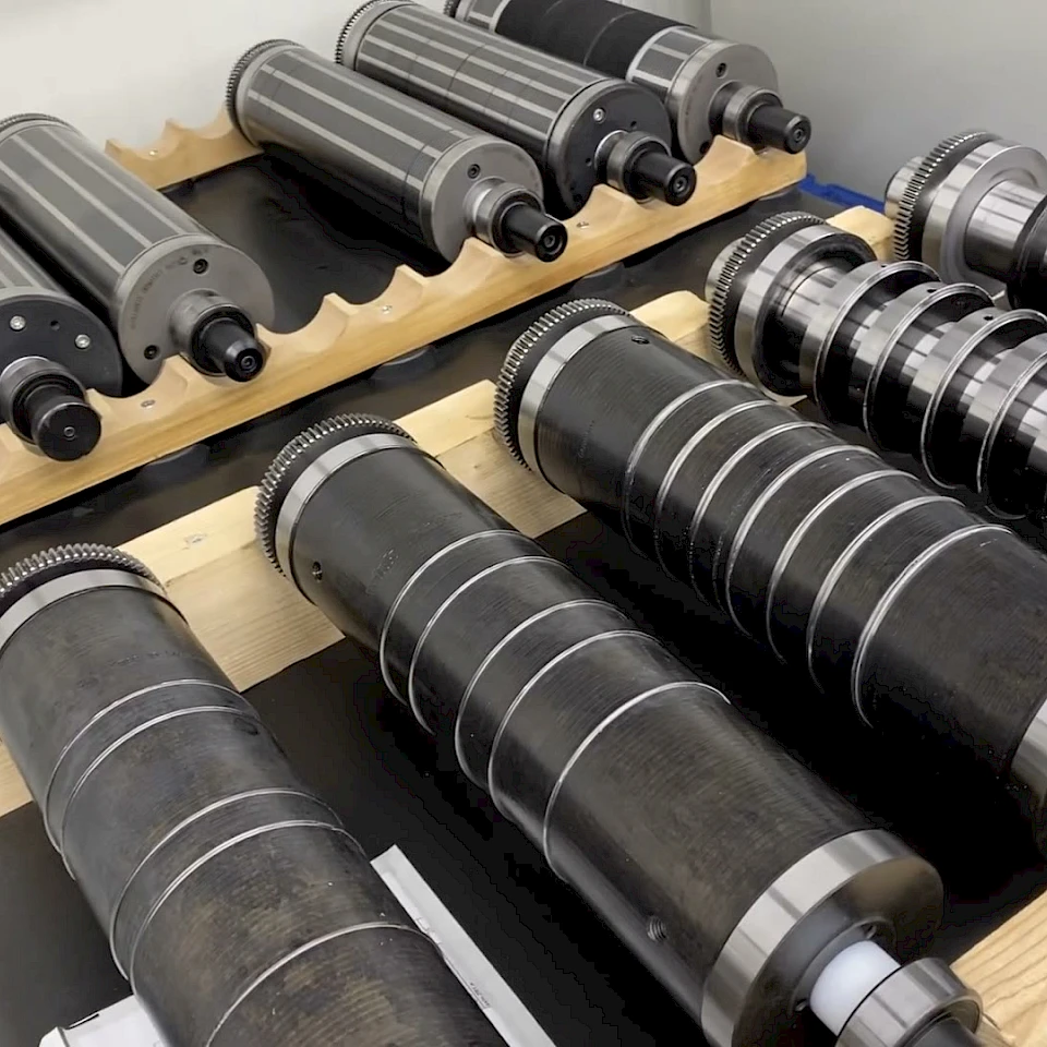 Rotary die cylinders on wooden racks