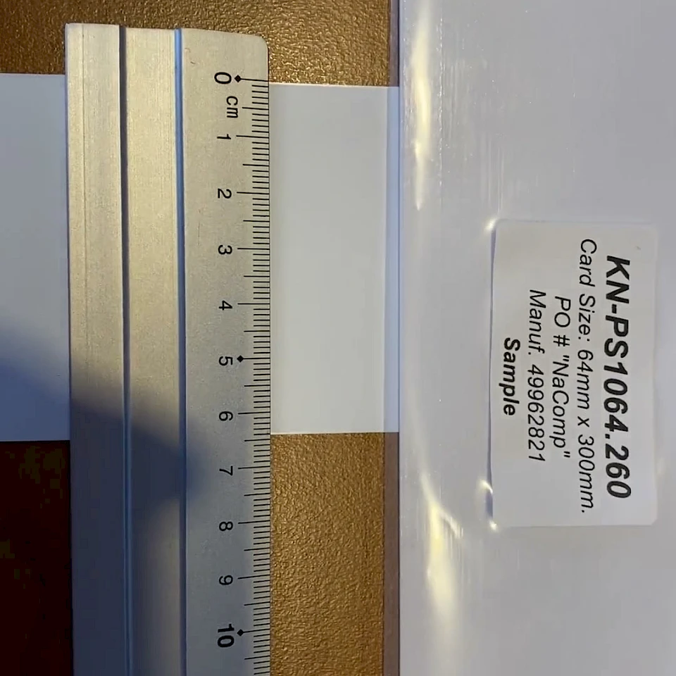 Sample backing card measured with steel ruler
