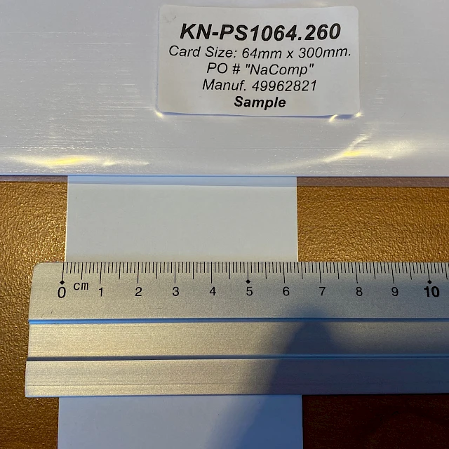 Sample backing card measured with steel ruler