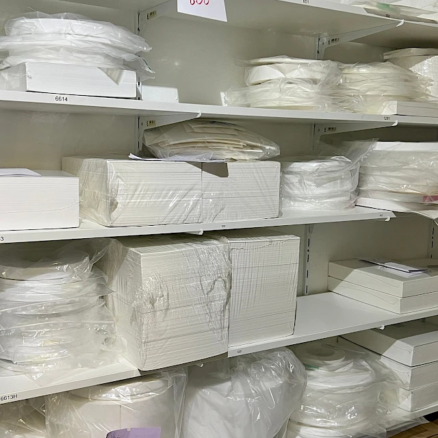 Shelves of bagged material rolls and sheets