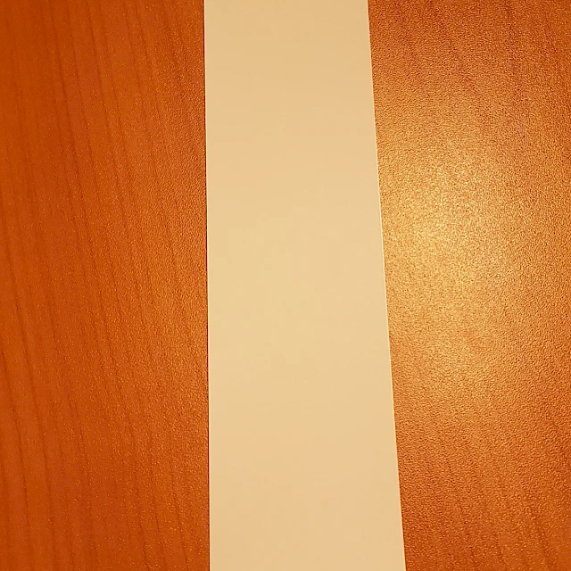 Single white backing card on wooden table