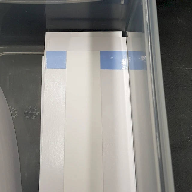 Slit strips in plastic tray
