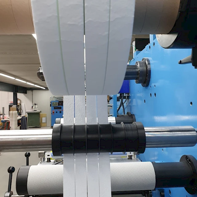 Slit white webs rewinding on slitter