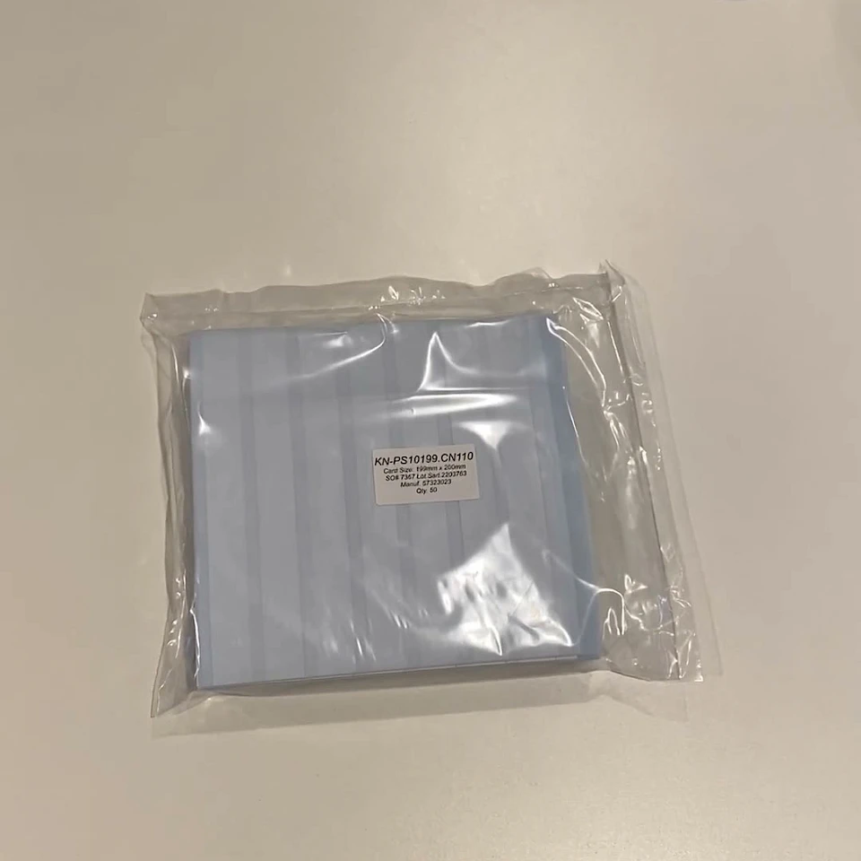 Small bag of blue backing cards on white