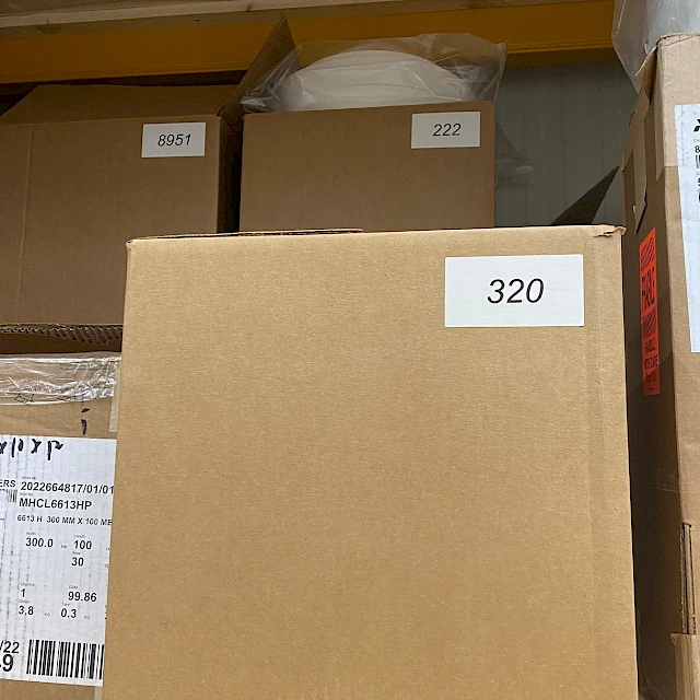 Stock cartons with grade numbers on rack