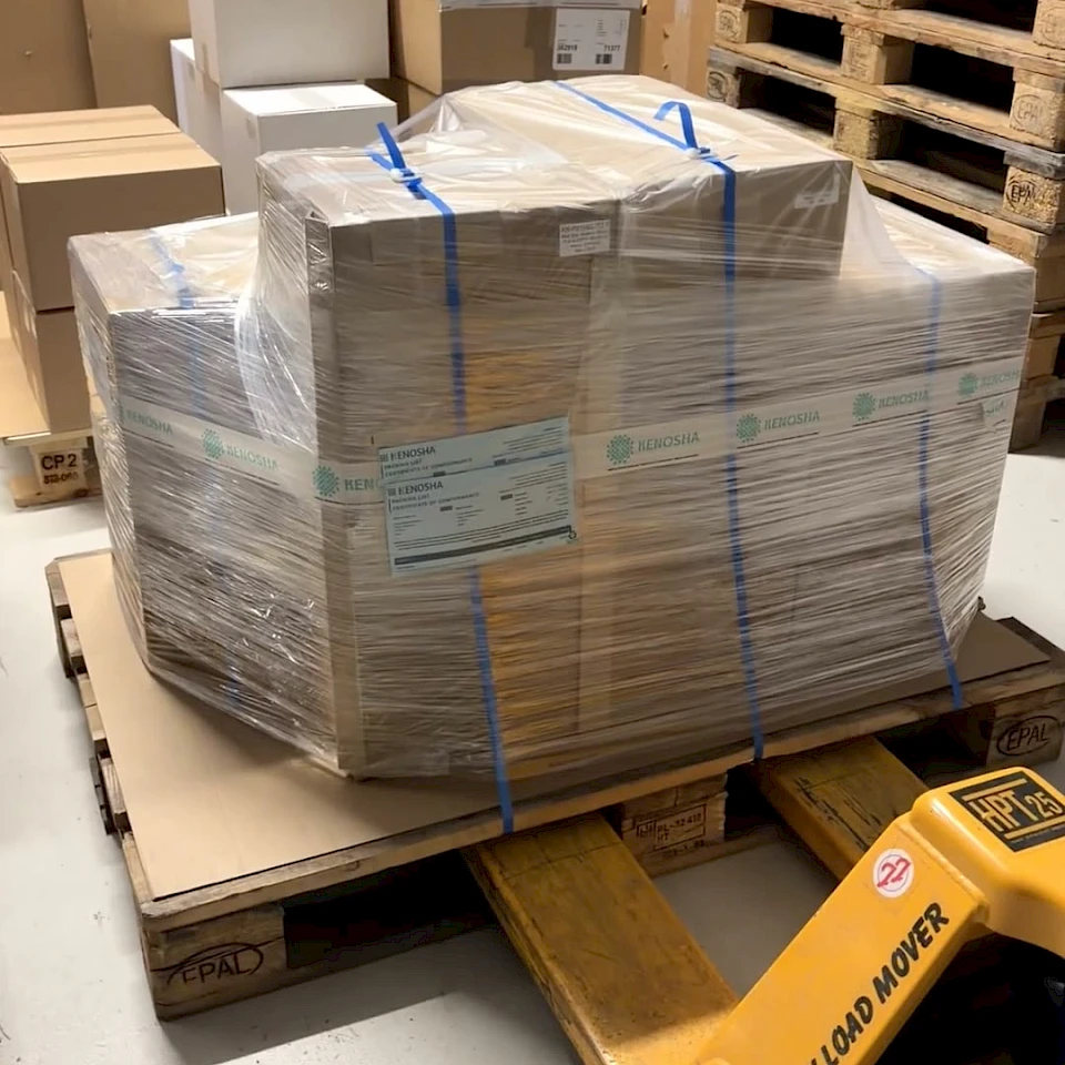 Strapped pallet on pallet jack warehouse
