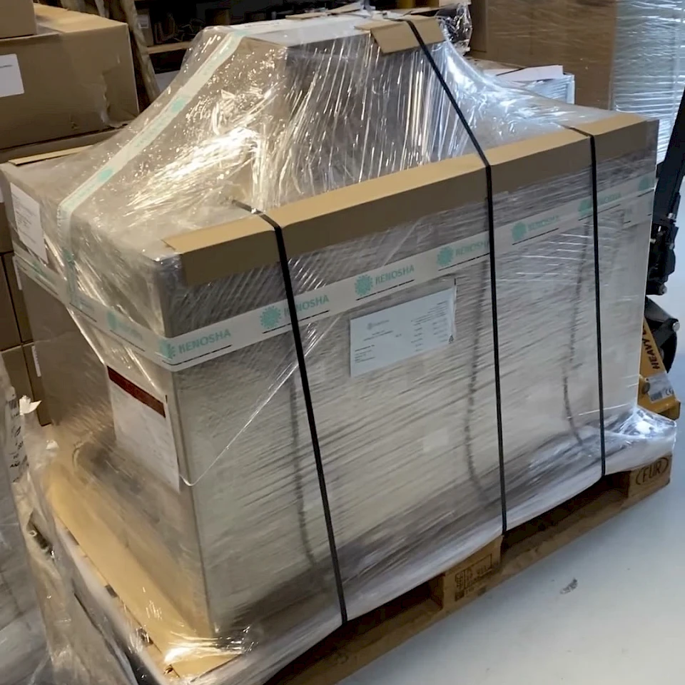 Stretch wrapped strapped pallet in workshop