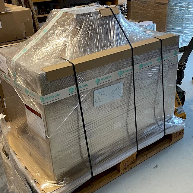 Stretch wrapped strapped pallet in workshop
