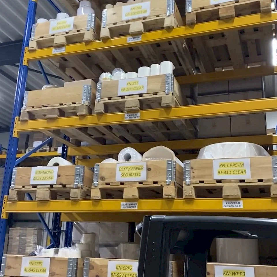 Tall pallet racking with stock and forklift
