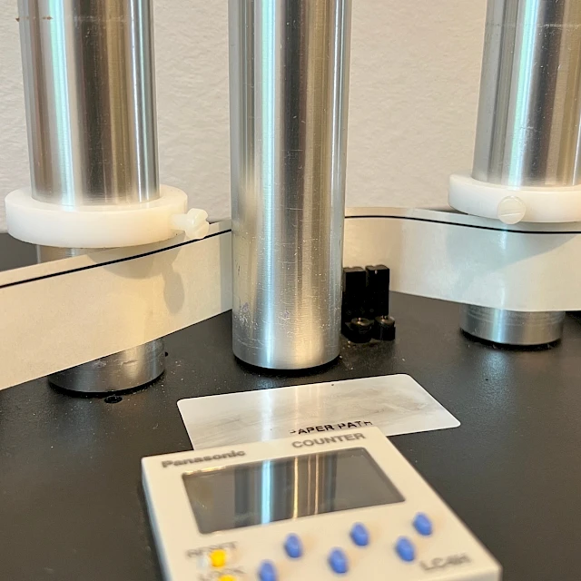 Tape counter and reel spindles on dispenser