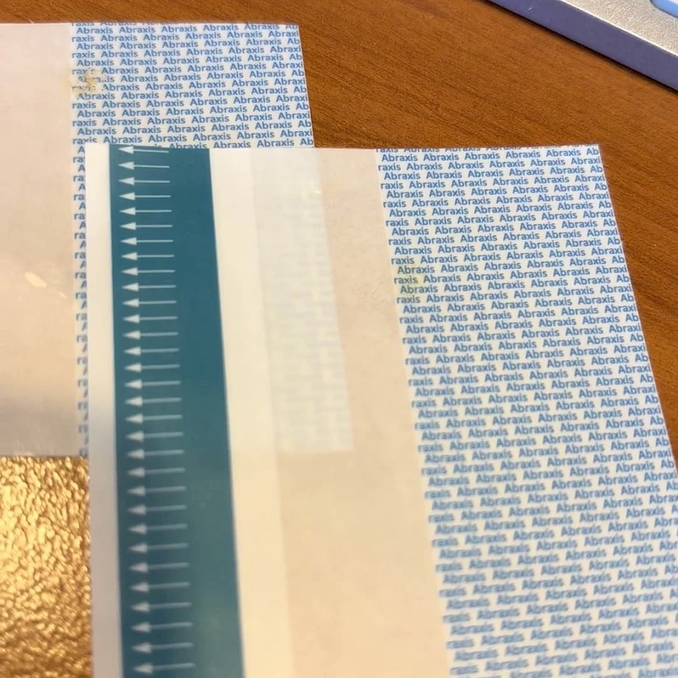 Teal arrow and blue print cover tape