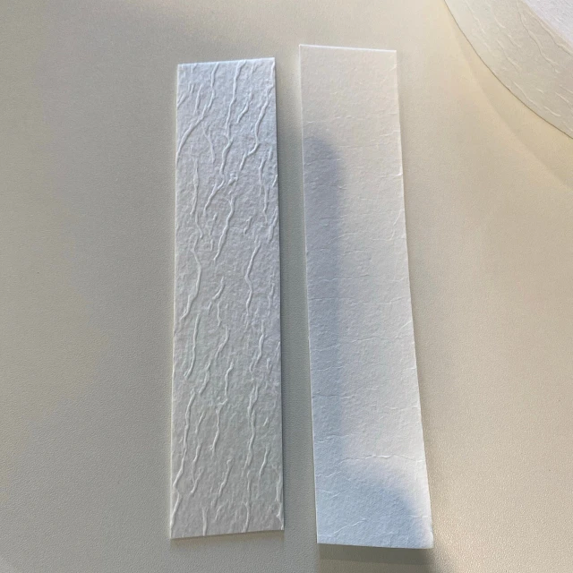 Two fibrous pads on roll