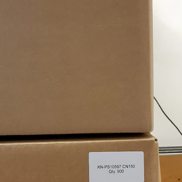 Two labelled cardboard boxes KN ps10597