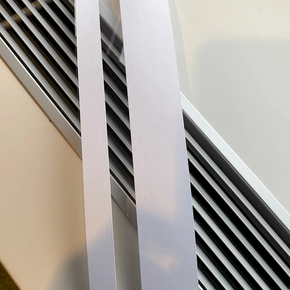 Two white card strips against wall
