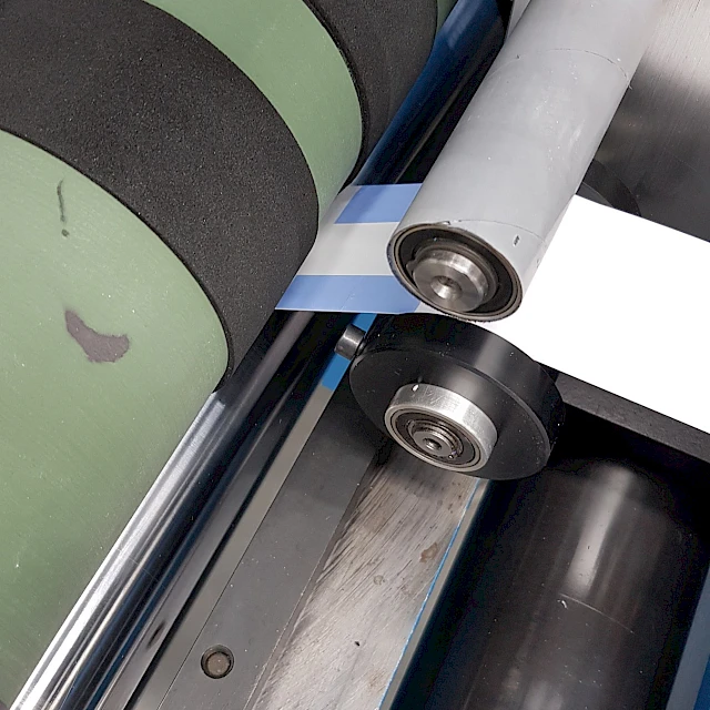 Web on slitter rollers