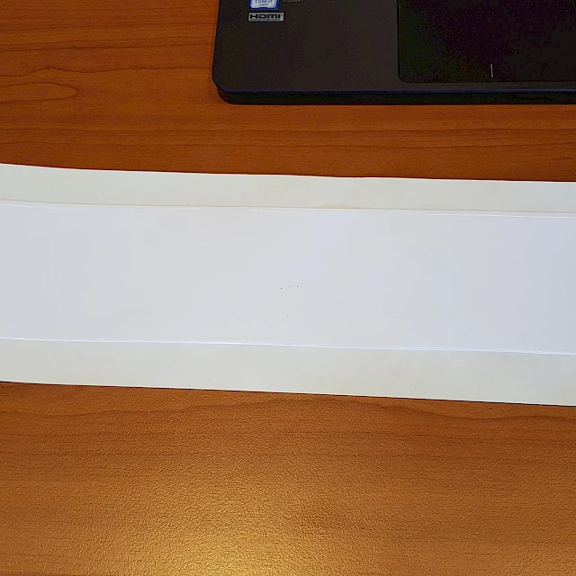 White backing card on wooden desk