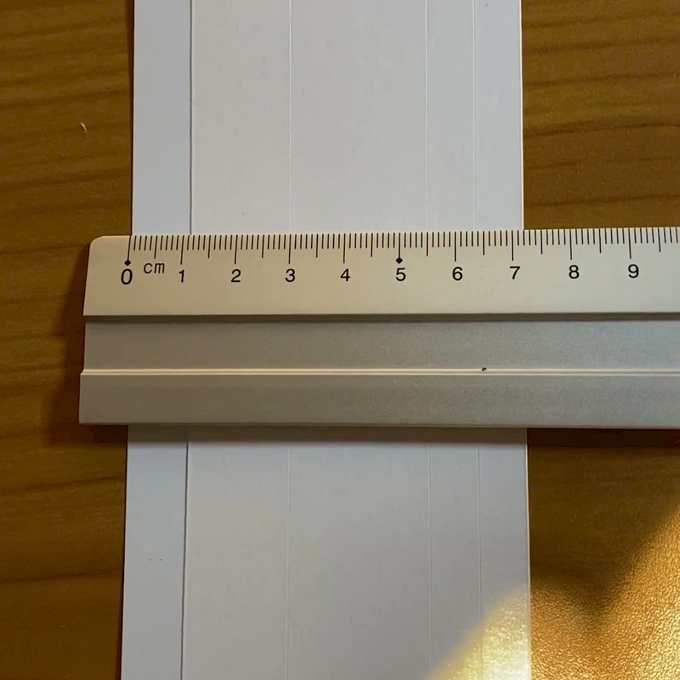 White card strip with ruler