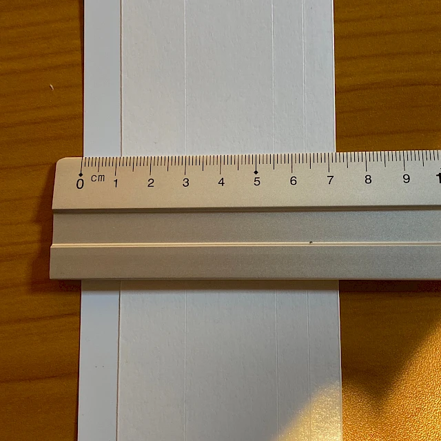 White card strip with ruler