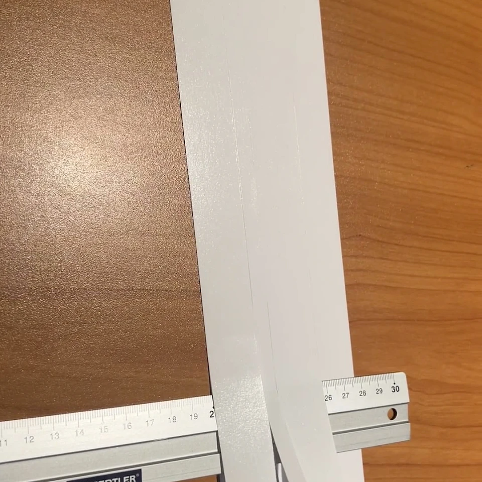 White card strips measured with ruler