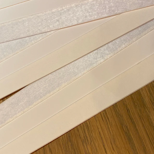 White cards with fibrous edge closeup