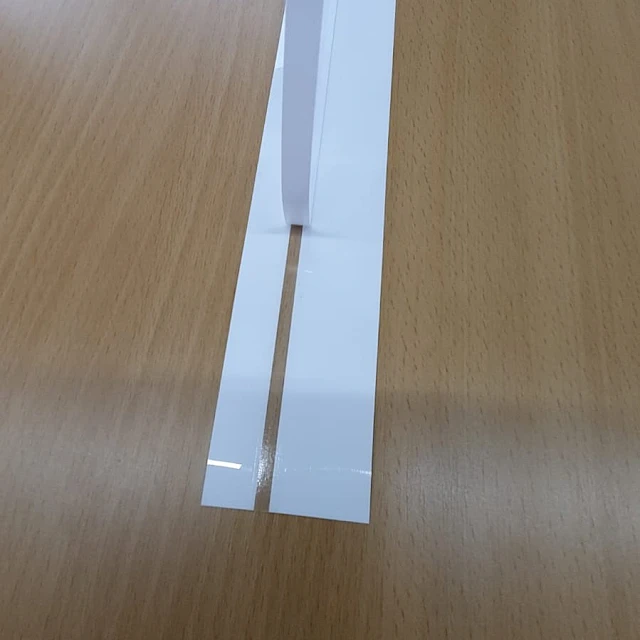 White cards with slit strip on desk