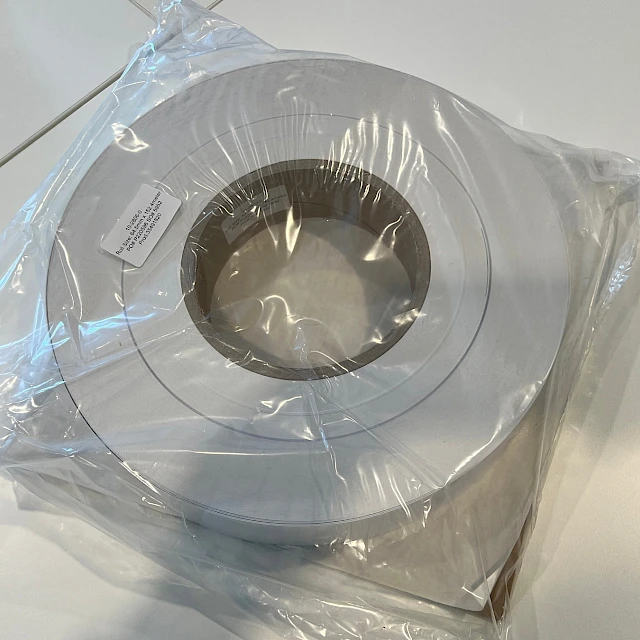 White material roll in plastic wrap
