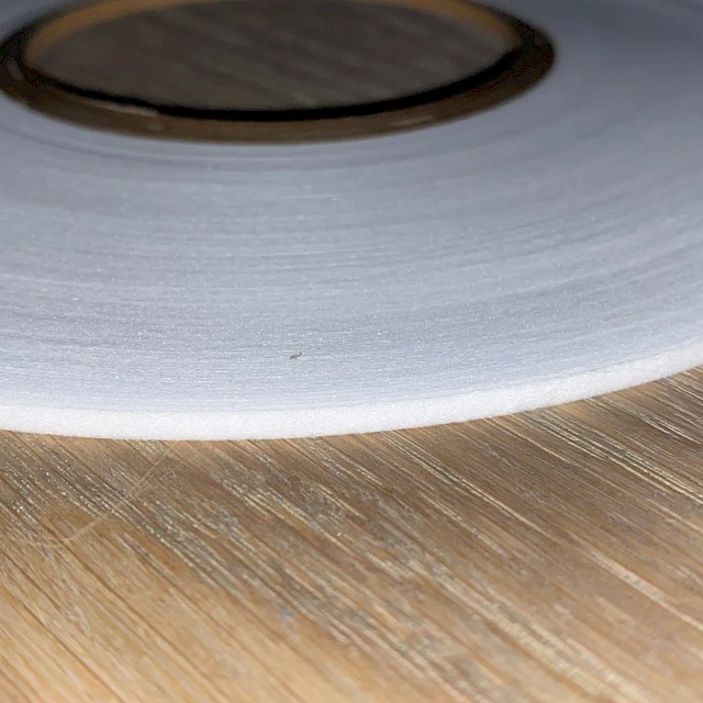 White pancake roll on wood closeup