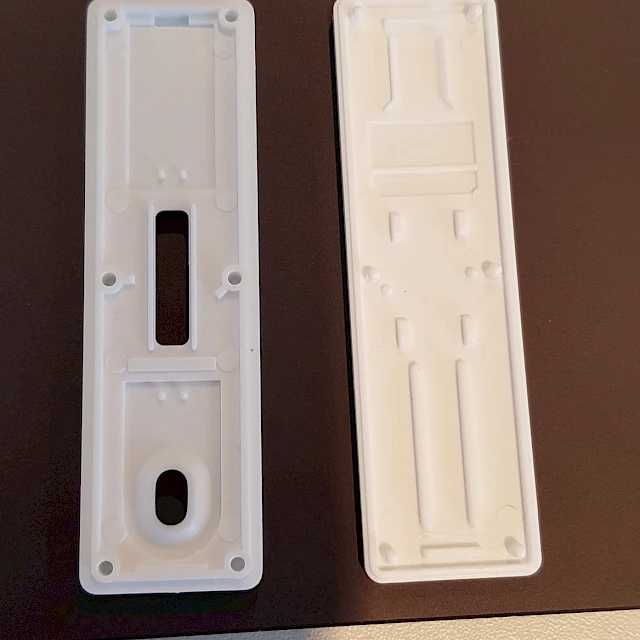 White plastic test cassette halves on laptop