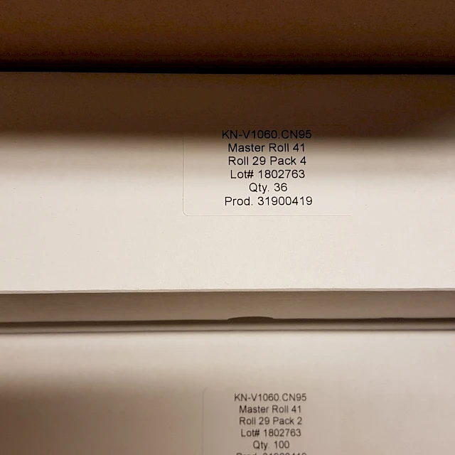 White product box label KN v1060 cn95 close up
