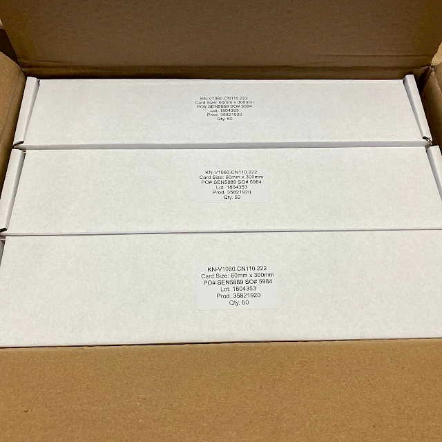 White product boxes with labels in carton