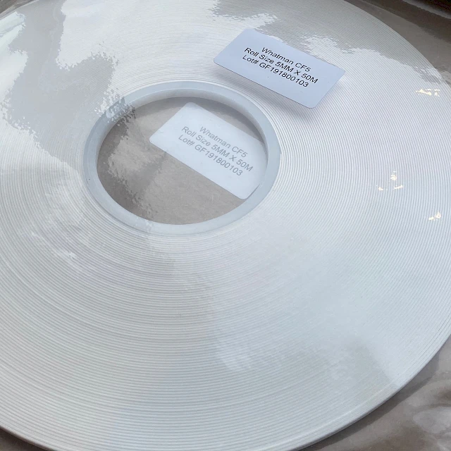 White roll in bag with label