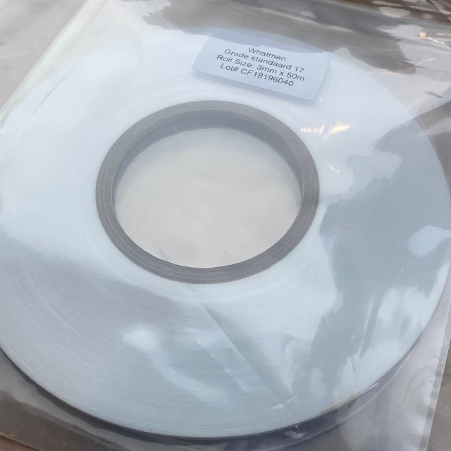 White roll in bag with label